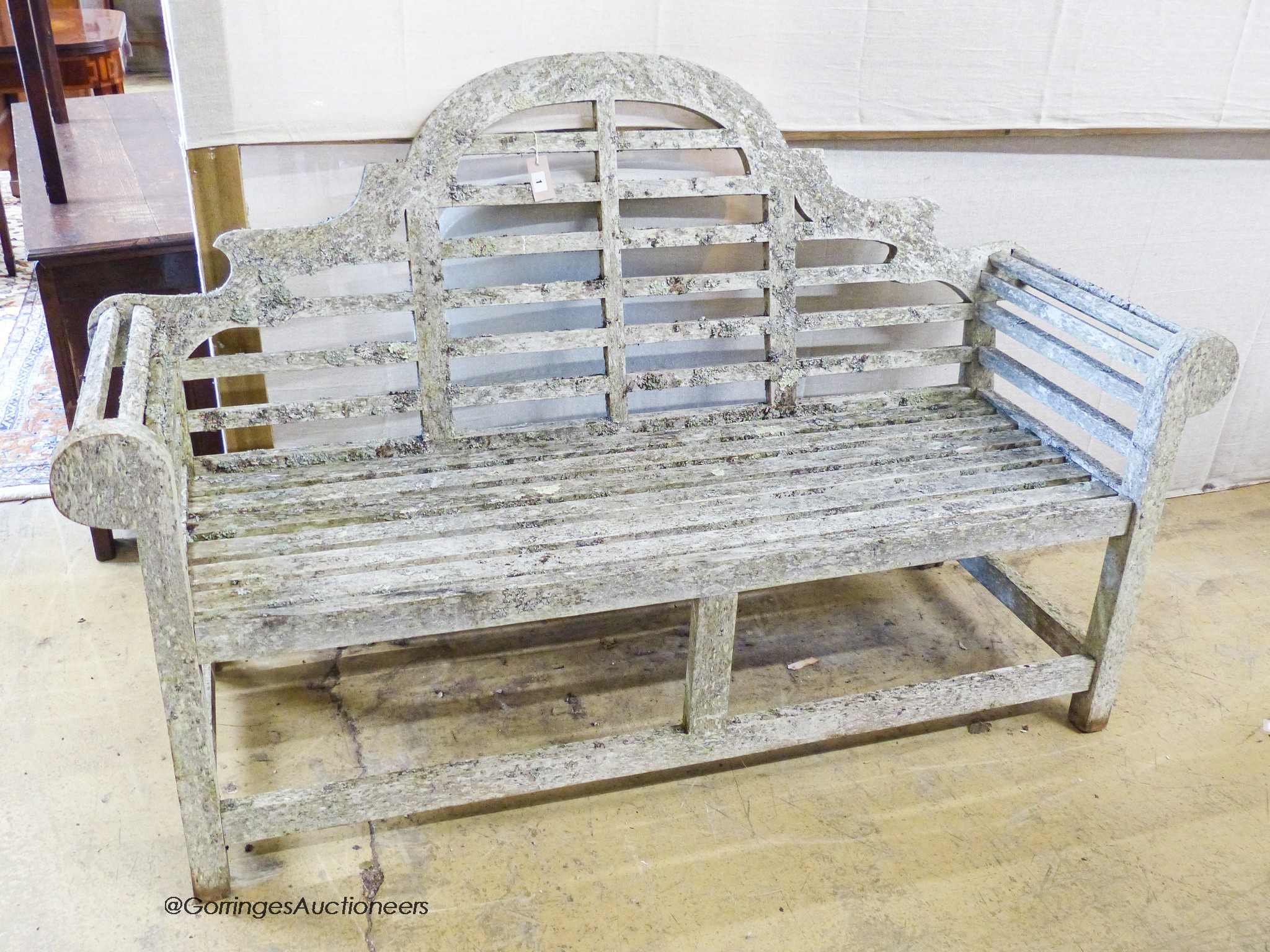 A weathered teak Lutchens style garden bench, length 166cm, depth 57cm, height 100cm